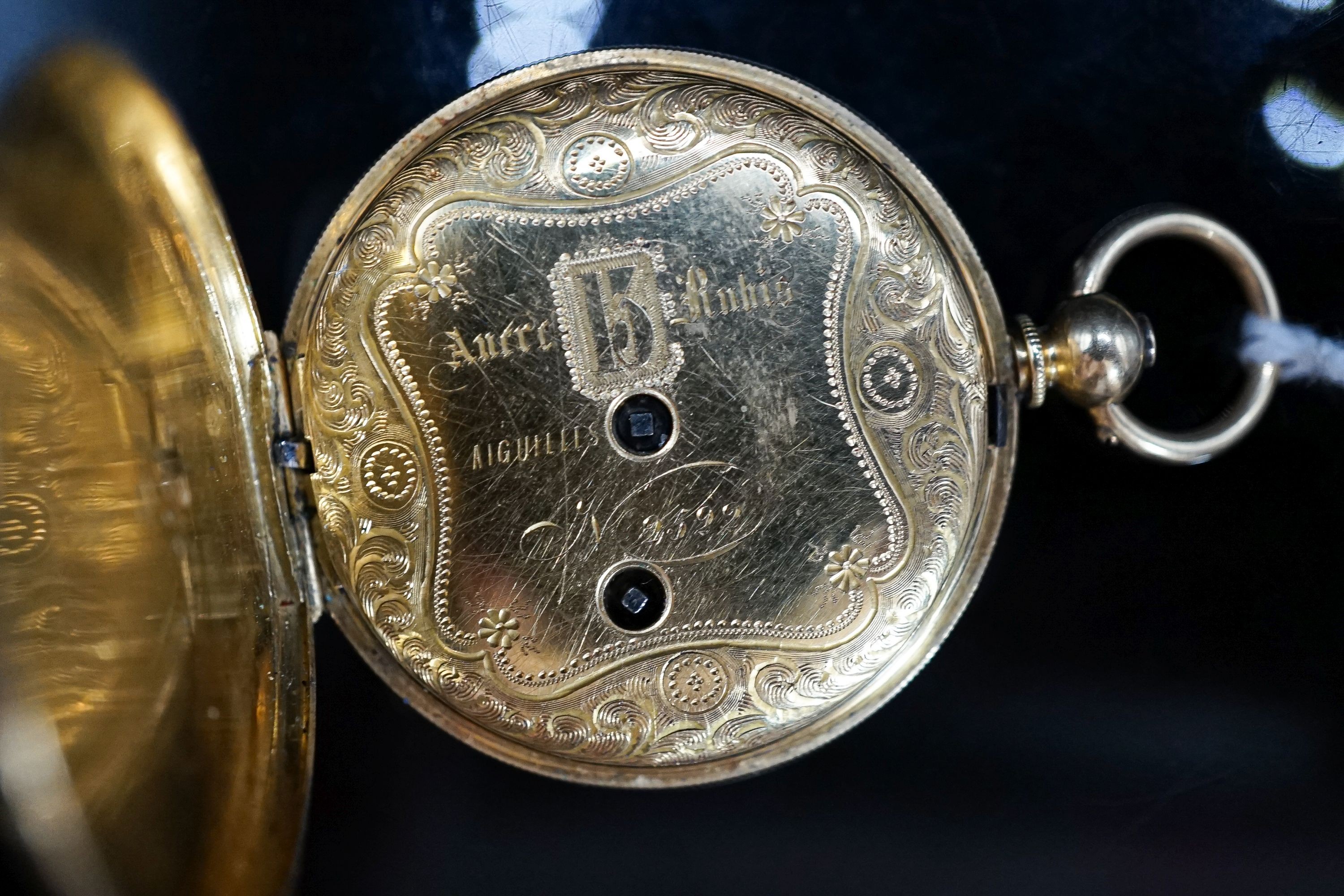 A continental engine turned 18k yellow metal hunter fob watch, with ornate dial, cased diameter 36mm